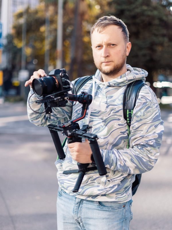 professional-videographer-with-gimball-video-setup-during-shooting.jpg